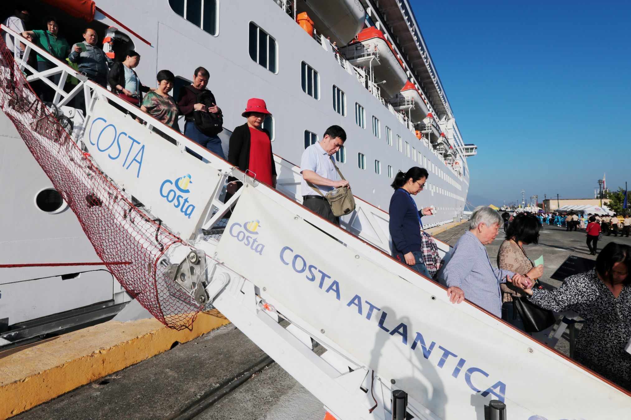 costa atlantica passengers disembark at subic